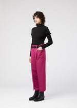 A model wears the 132 5. ISSEY MIYAKE 132 5. FLAT 1 trousers.