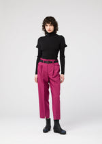 A model wears the 132 5. ISSEY MIYAKE 132 5. FLAT 1 trousers.