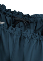 A detail shot of the 132 5. ISSEY MIYAKE PARALLEL WRAP trousers.