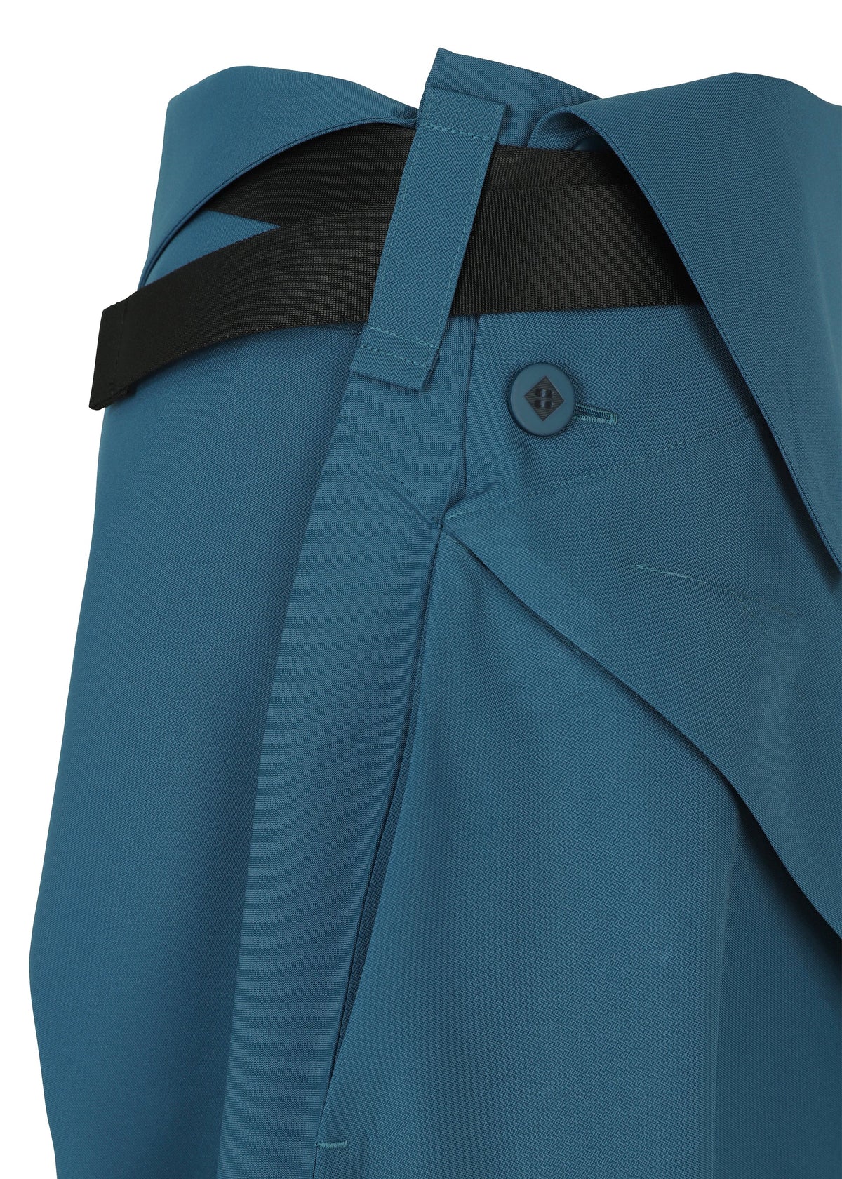 A detail shot of the 132 5. ISSEY MIYAKE FACET SOLID trousers.