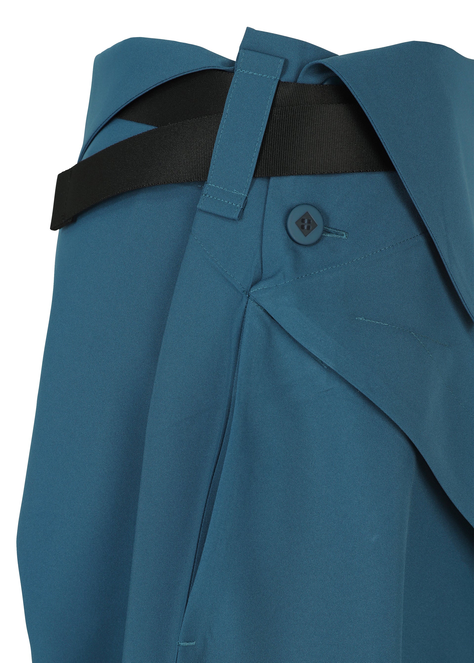 A detail shot of the 132 5. ISSEY MIYAKE FACET SOLID trousers.