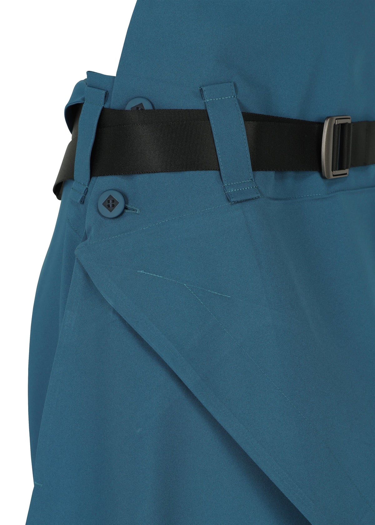 A detail shot of the 132 5. ISSEY MIYAKE FACET SOLID trousers.