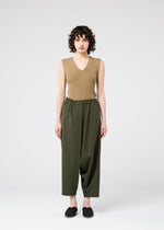 A model wears the 132 5. ISSEY MIYAKE SEAMLESS trousers.