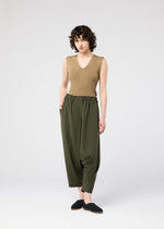 A model wears the 132 5. ISSEY MIYAKE SEAMLESS trousers.
