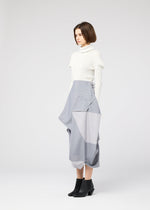 A model wears the 132 5. ISSEY MIYAKE NO.17 PRINT skirt.
