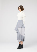 A model wears the 132 5. ISSEY MIYAKE NO.17 PRINT skirt.