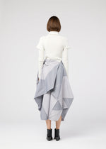 A model wears the 132 5. ISSEY MIYAKE NO.17 PRINT skirt.