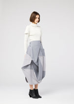 A model wears the 132 5. ISSEY MIYAKE NO.17 PRINT skirt.