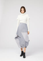 A model wears the 132 5. ISSEY MIYAKE NO.17 PRINT skirt.