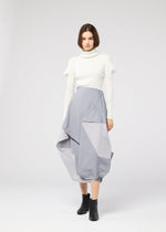 A model wears the 132 5. ISSEY MIYAKE NO.17 PRINT skirt.