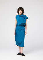 A model wears the 132 5. ISSEY MIYAKE FACET SOLID dress.