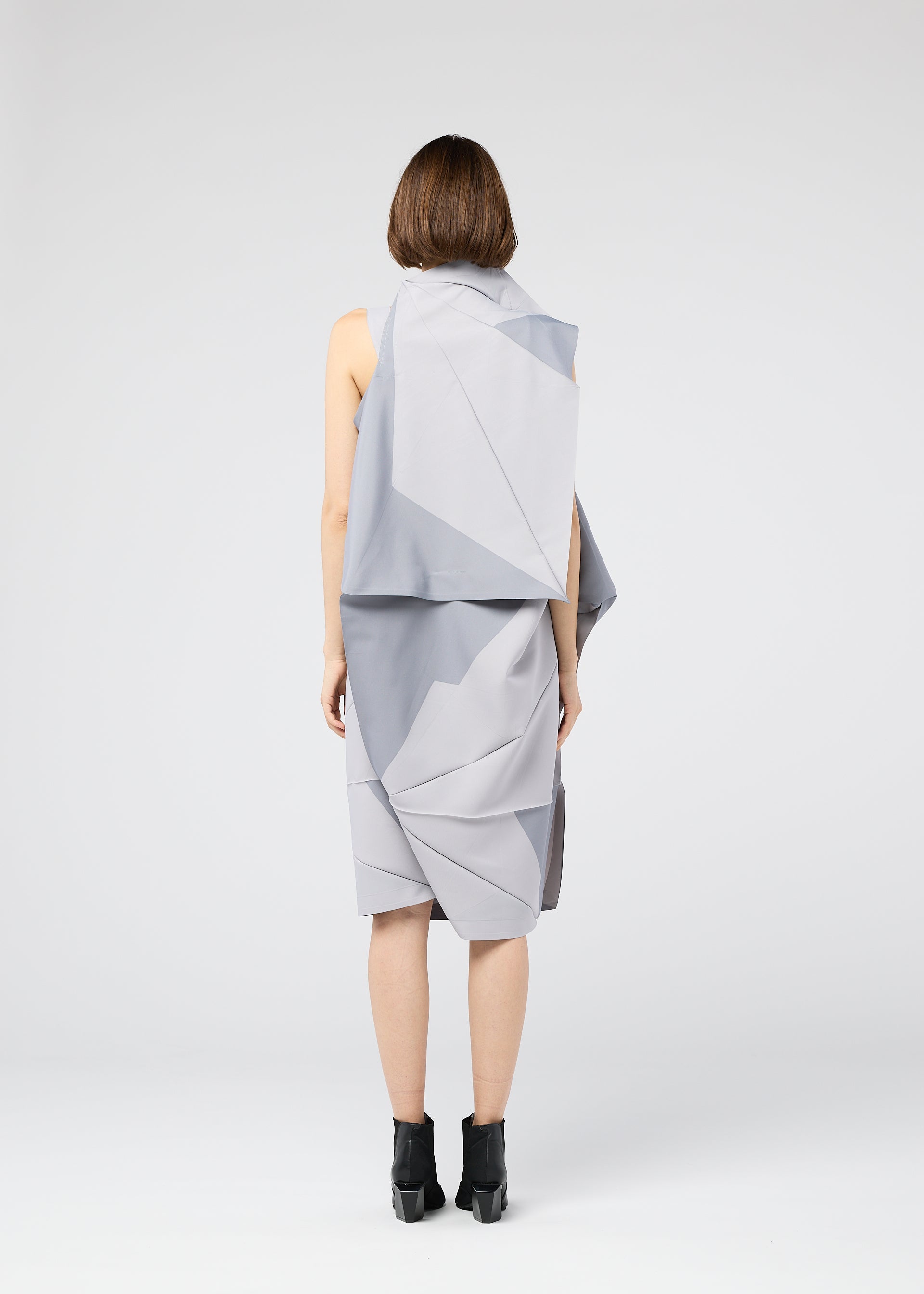 A model wears the 132 5. ISSEY MIYAKE NO.17 PRINT dress.