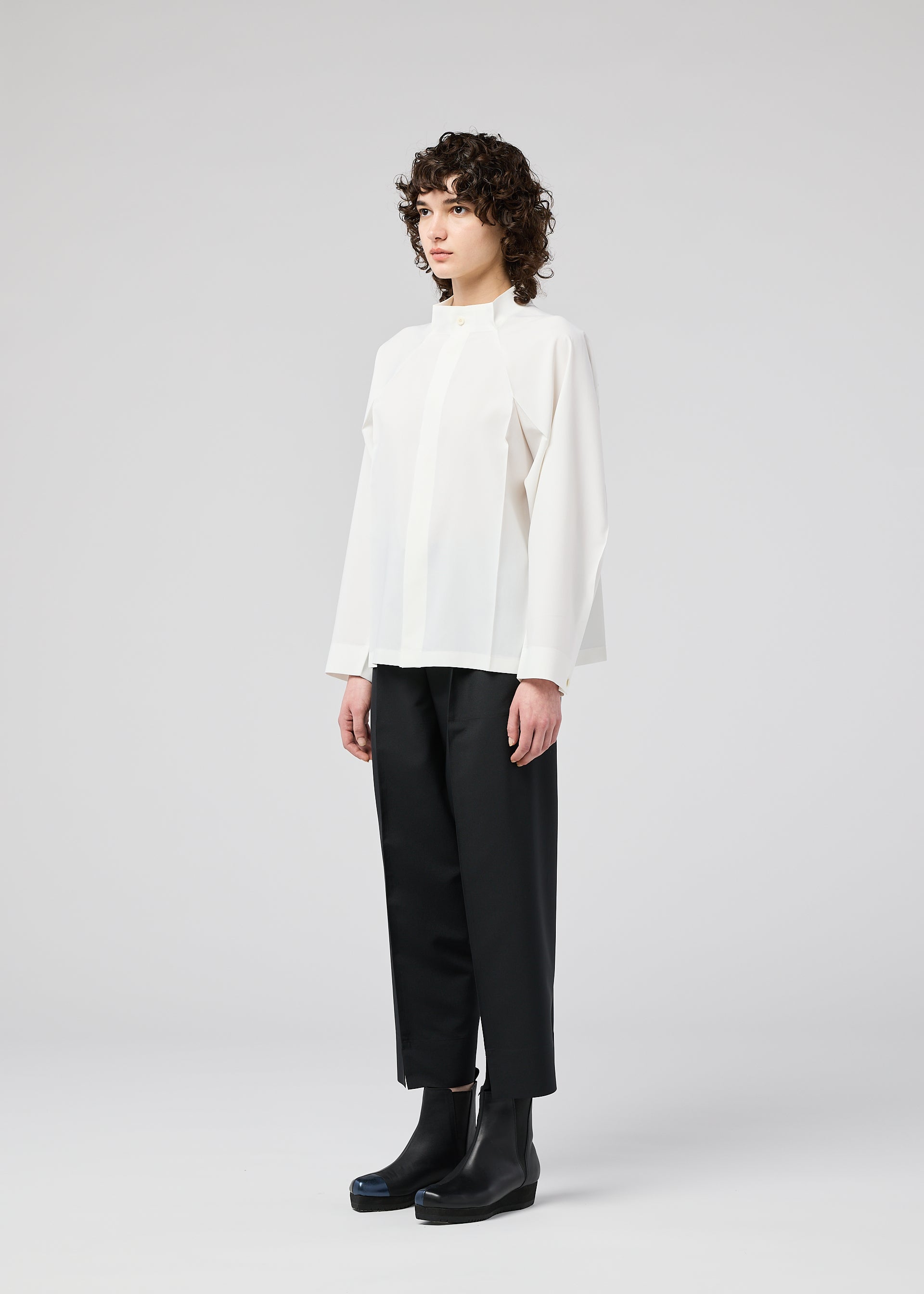 A model wears the 132 5. ISSEY MIYAKE FOLD SHIRT shirt.