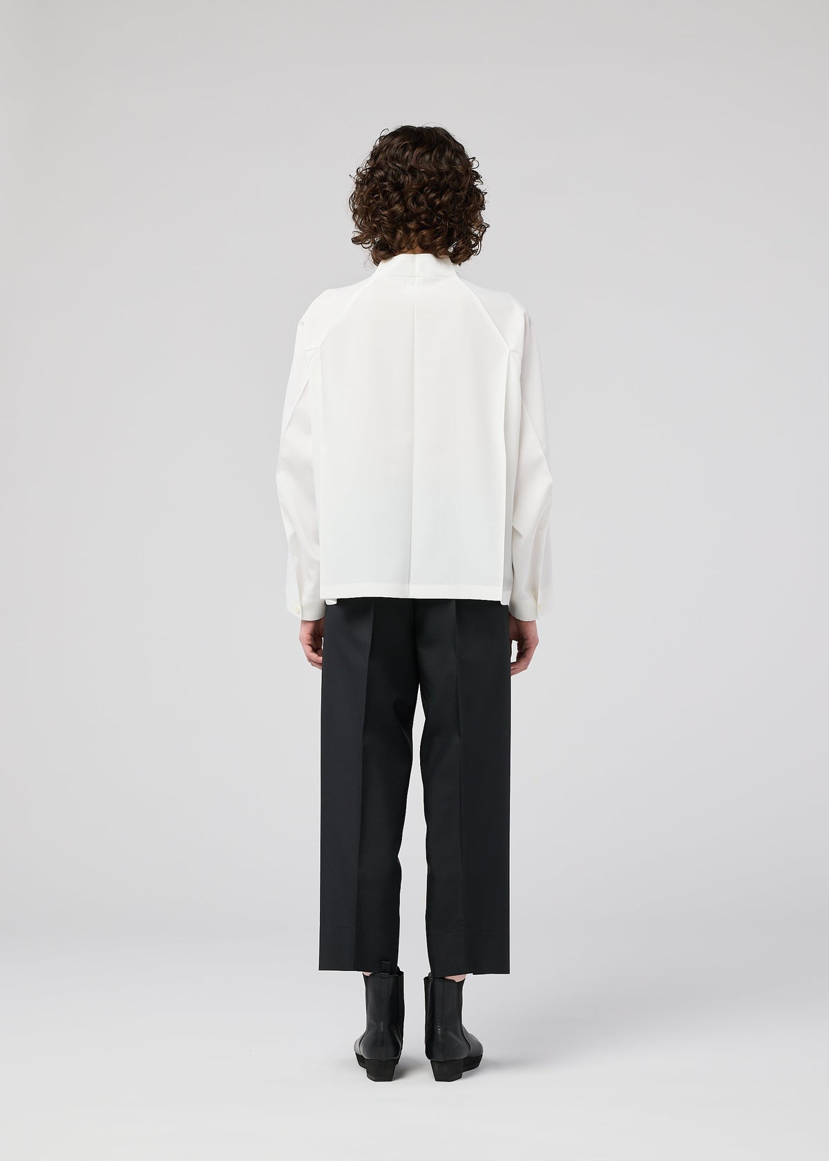 A model wears the 132 5. ISSEY MIYAKE FOLD SHIRT shirt.