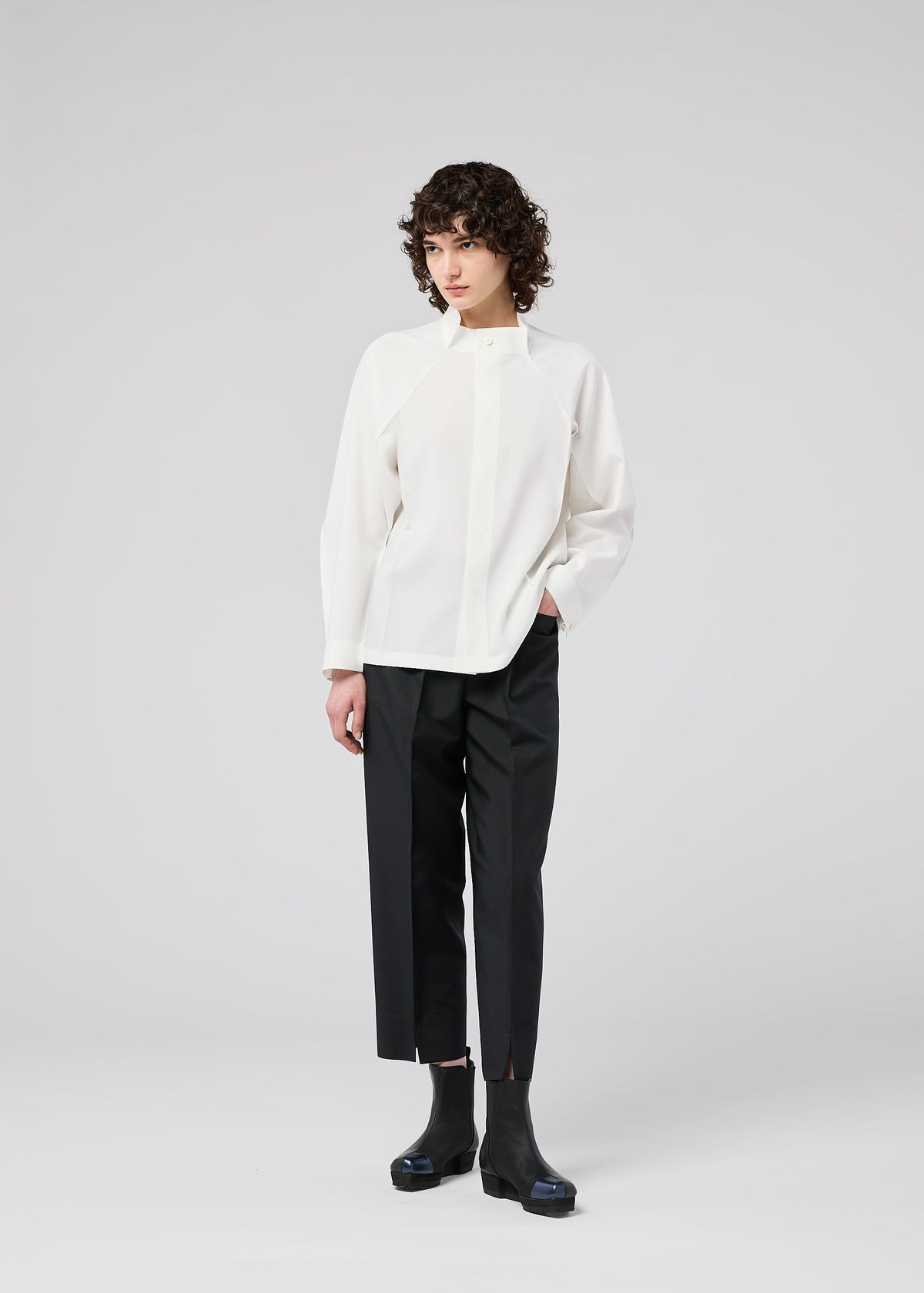 A model wears the 132 5. ISSEY MIYAKE FOLD SHIRT shirt.