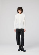 A model wears the 132 5. ISSEY MIYAKE FOLD SHIRT shirt.