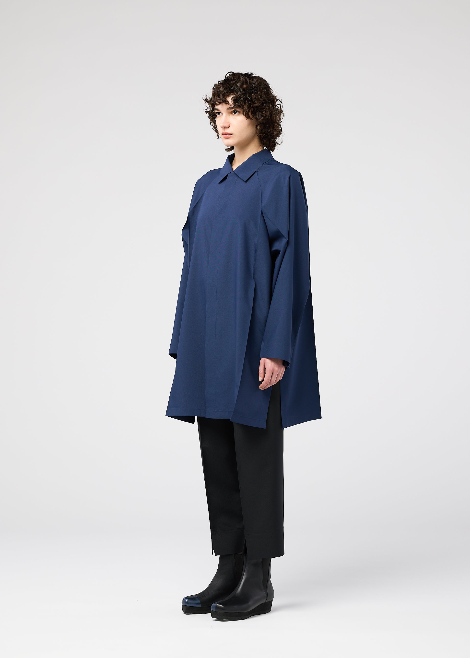 A model wears the 132 5. ISSEY MIYAKE FOLD SHIRT shirt.