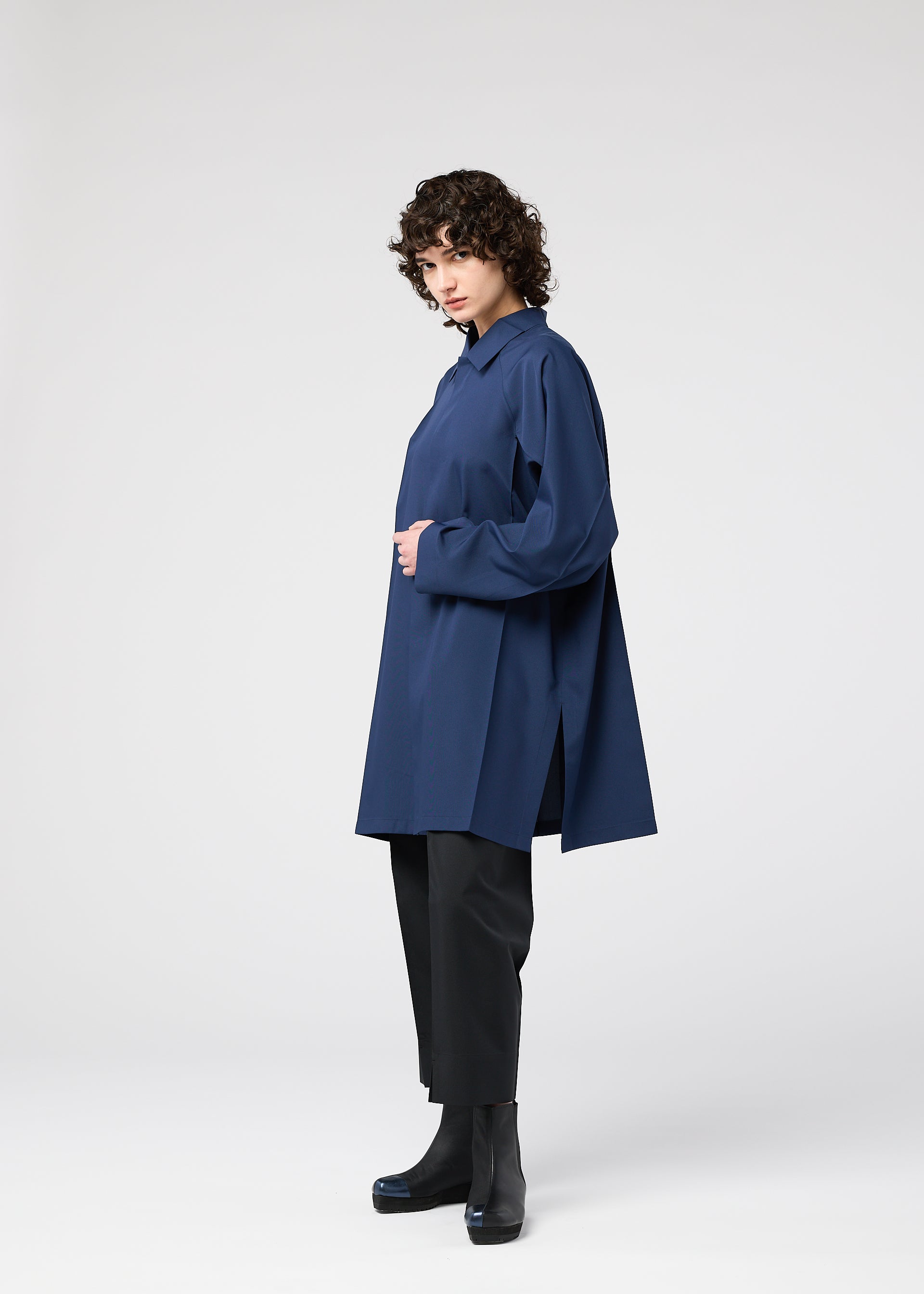 A model wears the 132 5. ISSEY MIYAKE FOLD SHIRT shirt.