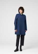 A model wears the 132 5. ISSEY MIYAKE FOLD SHIRT shirt.