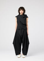 A model wears the 132 5. ISSEY MIYAKE FACET SOLID shirt.