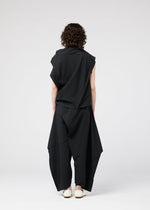 A model wears the 132 5. ISSEY MIYAKE FACET SOLID shirt.