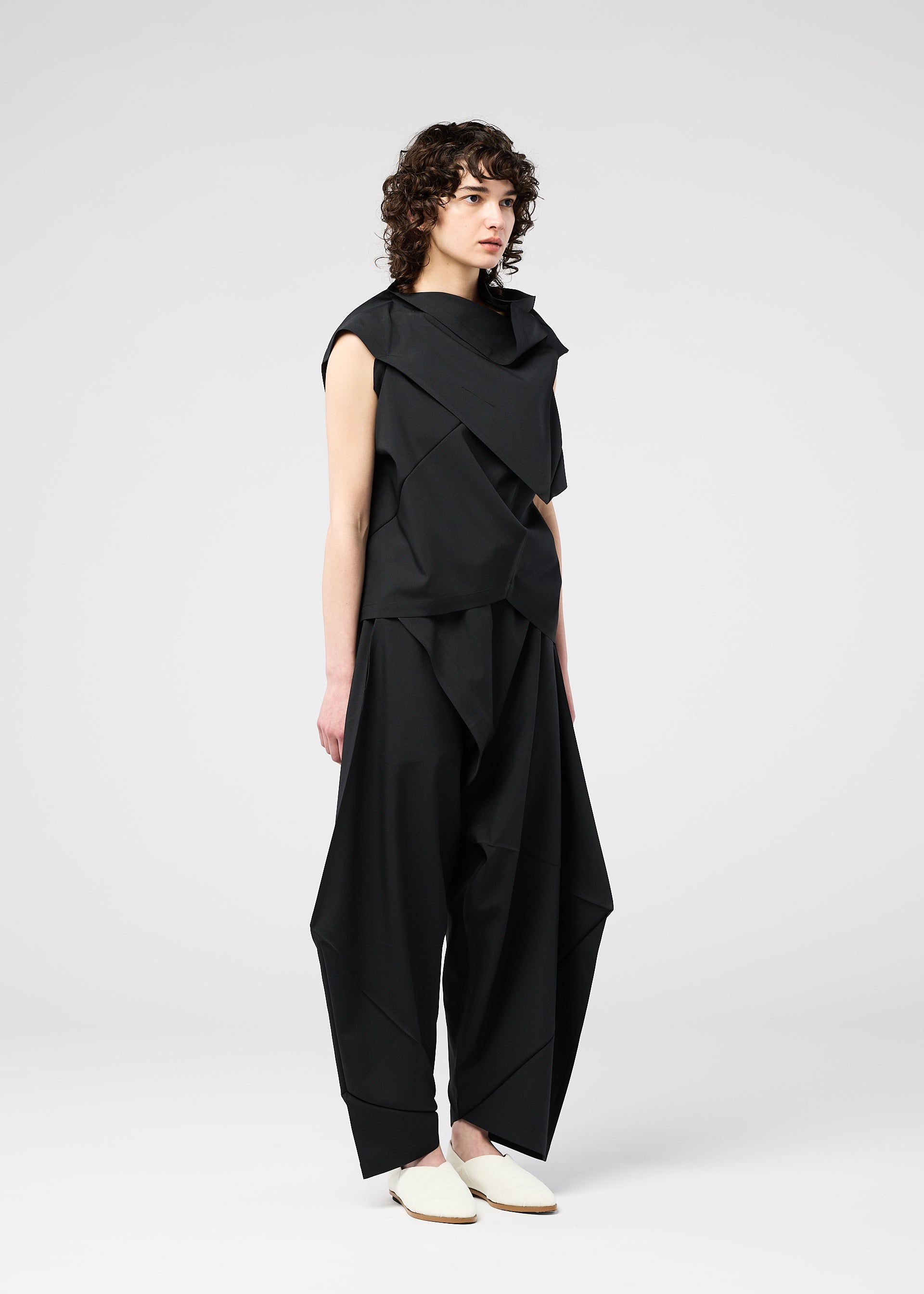 A model wears the 132 5. ISSEY MIYAKE FACET SOLID shirt.