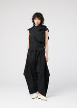 A model wears the 132 5. ISSEY MIYAKE FACET SOLID shirt.