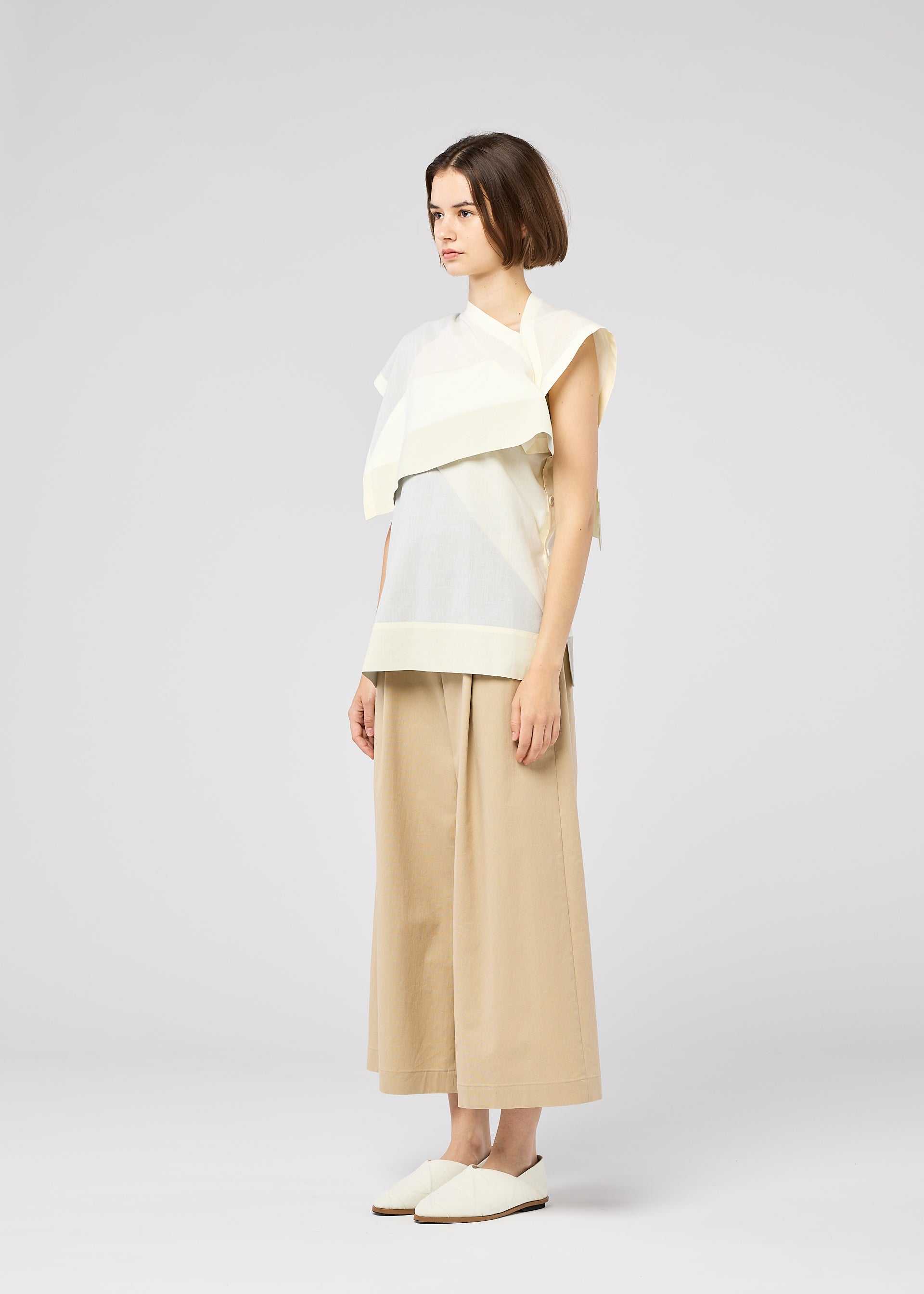 A model wears the 132 5. ISSEY MIYAKE FOLD RAMIE PRINT shirt.