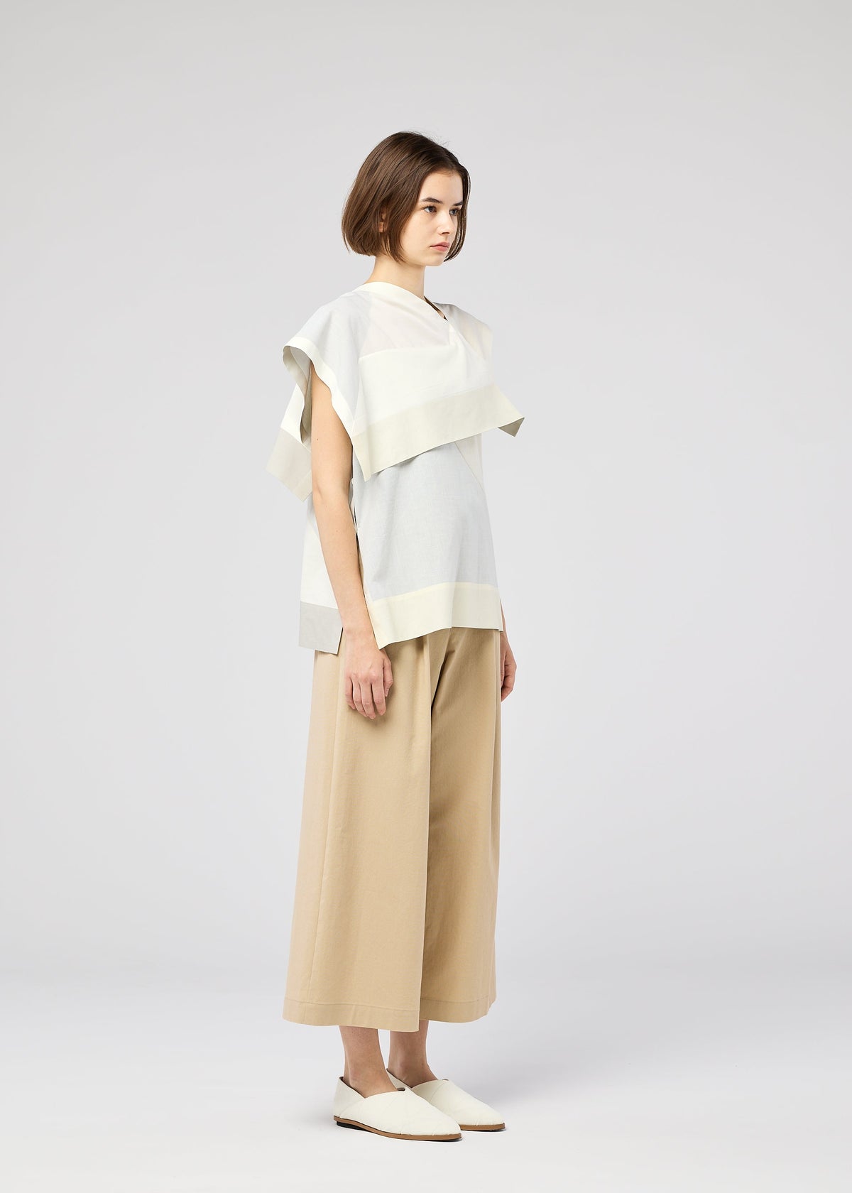 A model wears the 132 5. ISSEY MIYAKE FOLD RAMIE PRINT shirt.