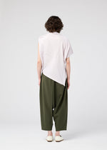 A model wears the 132 5. ISSEY MIYAKE RADIAL FOLD SHIRT top.