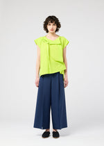 A model wears the 132 5. ISSEY MIYAKE FLAT TUCK T flat-tuck-t-shirt-yellow-green.
