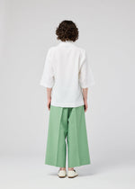 A model wears the 132 5. ISSEY MIYAKE FLAT TUCK T flat-tuck-t-shirt-white-1.