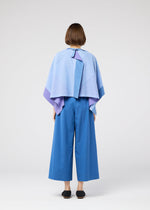 A model wears the 132 5. ISSEY MIYAKE FOLD RAMIE PRINT shirt.