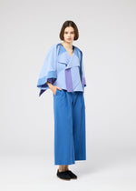 A model wears the 132 5. ISSEY MIYAKE FOLD RAMIE PRINT shirt.