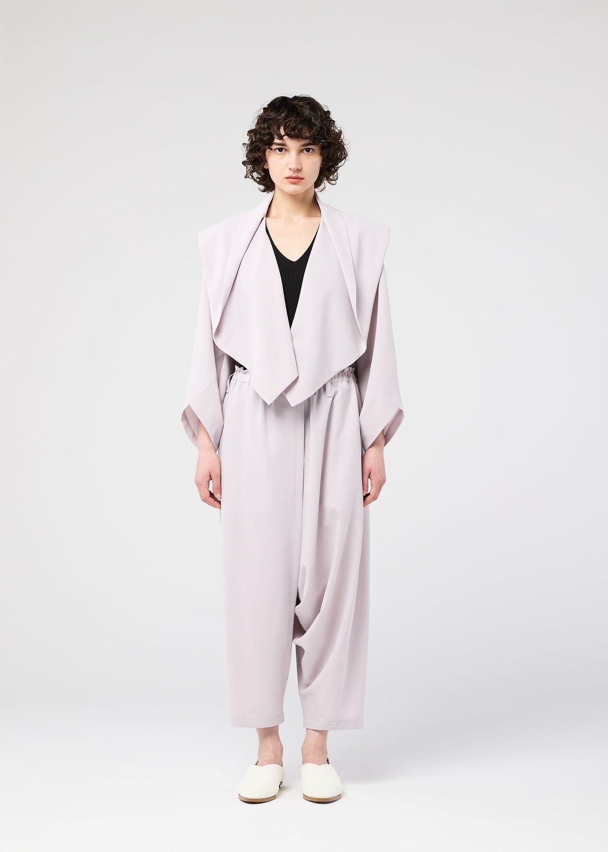 A model wears the 132 5. ISSEY MIYAKE SEAMLESS cardigan.