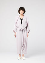 A model wears the 132 5. ISSEY MIYAKE SEAMLESS cardigan.