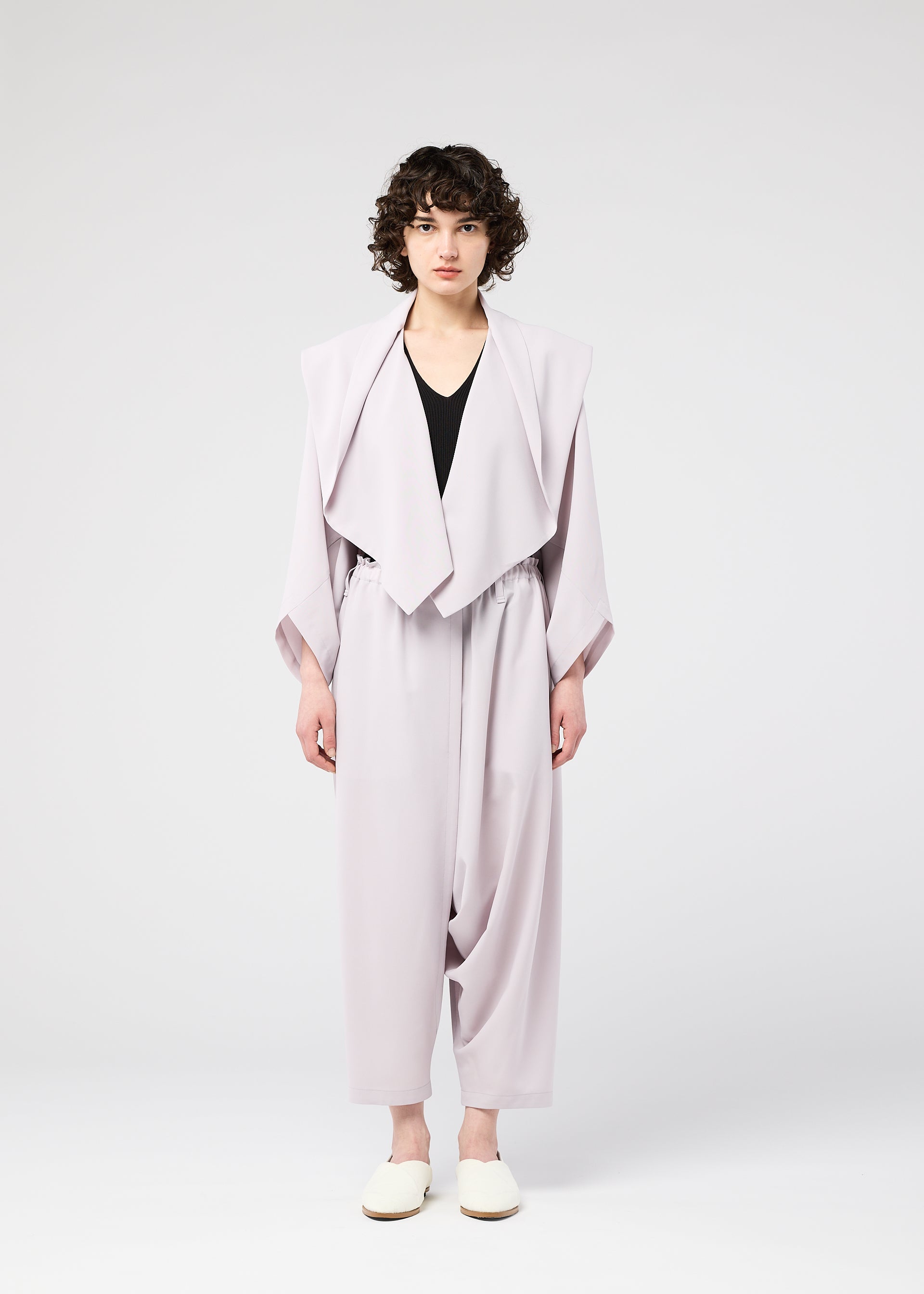 A model wears the 132 5. ISSEY MIYAKE SEAMLESS cardigan.