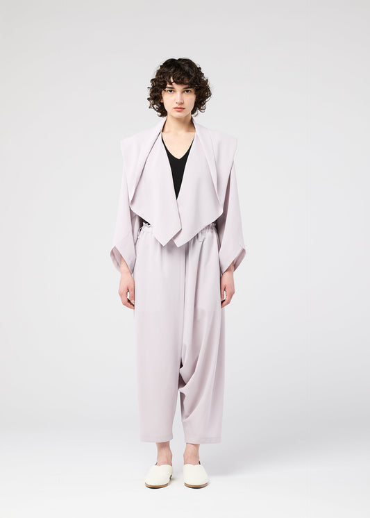 A model wears the 132 5. ISSEY MIYAKE SEAMLESS cardigan.