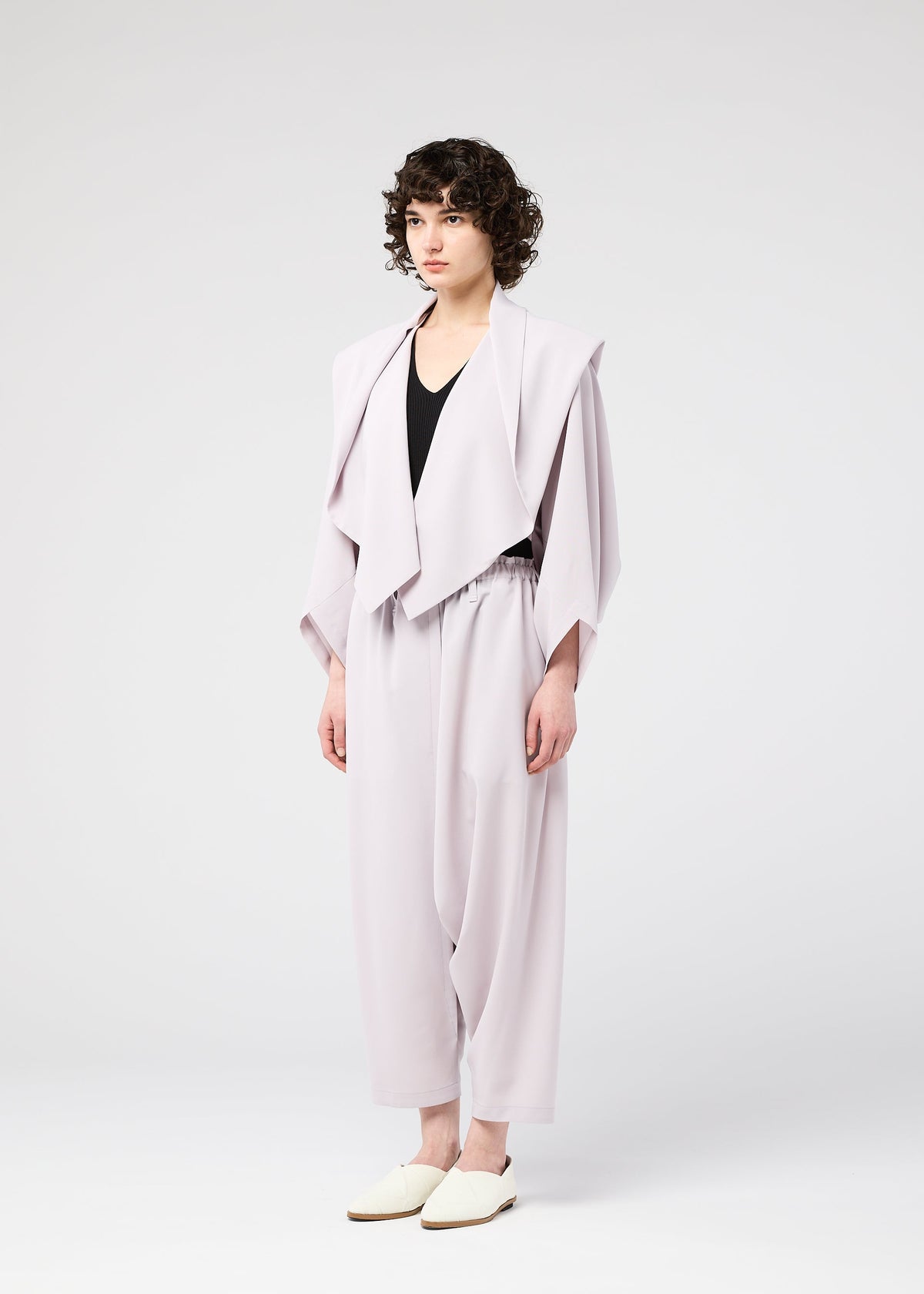 A model wears the 132 5. ISSEY MIYAKE SEAMLESS cardigan.