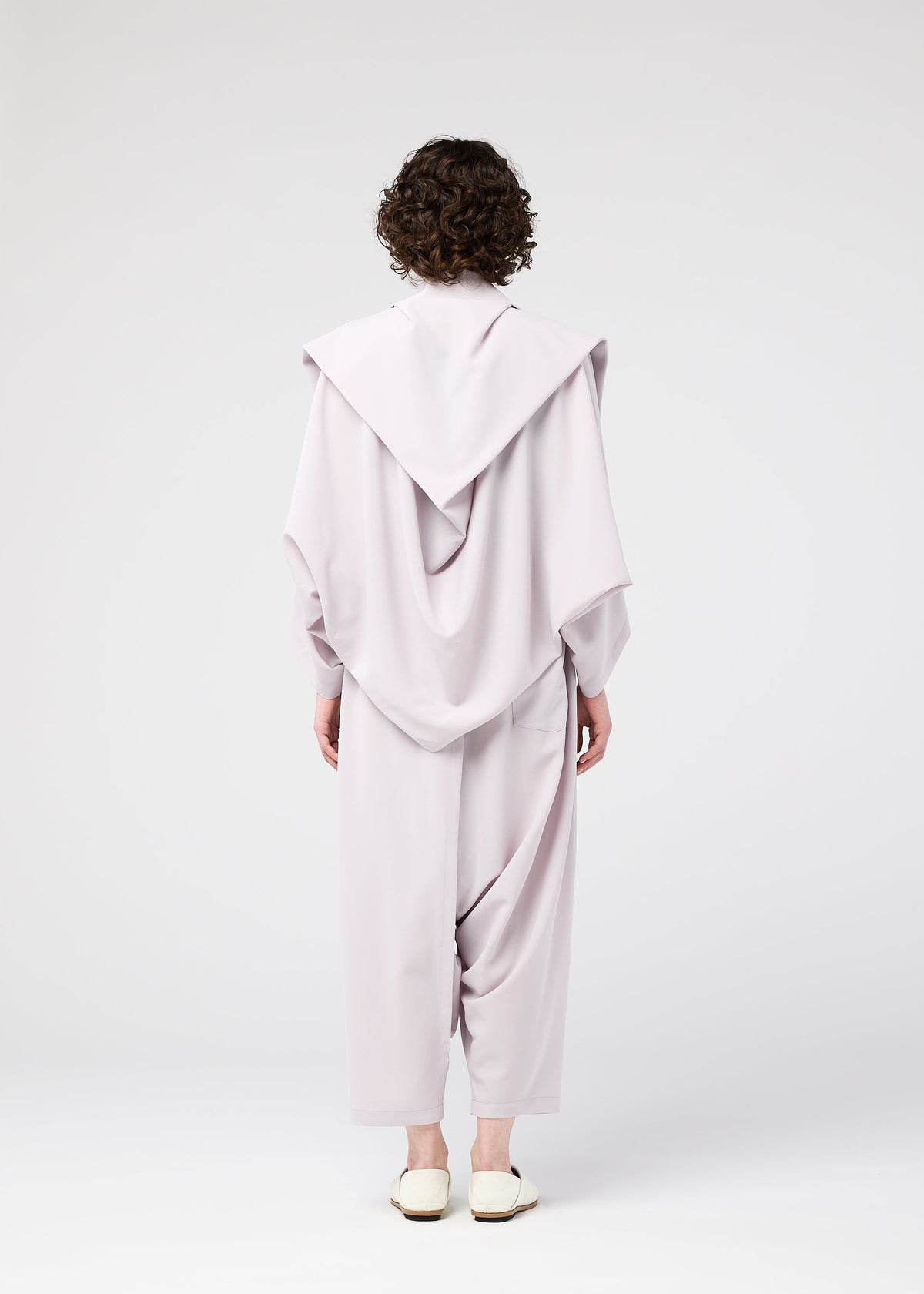A model wears the 132 5. ISSEY MIYAKE SEAMLESS cardigan.