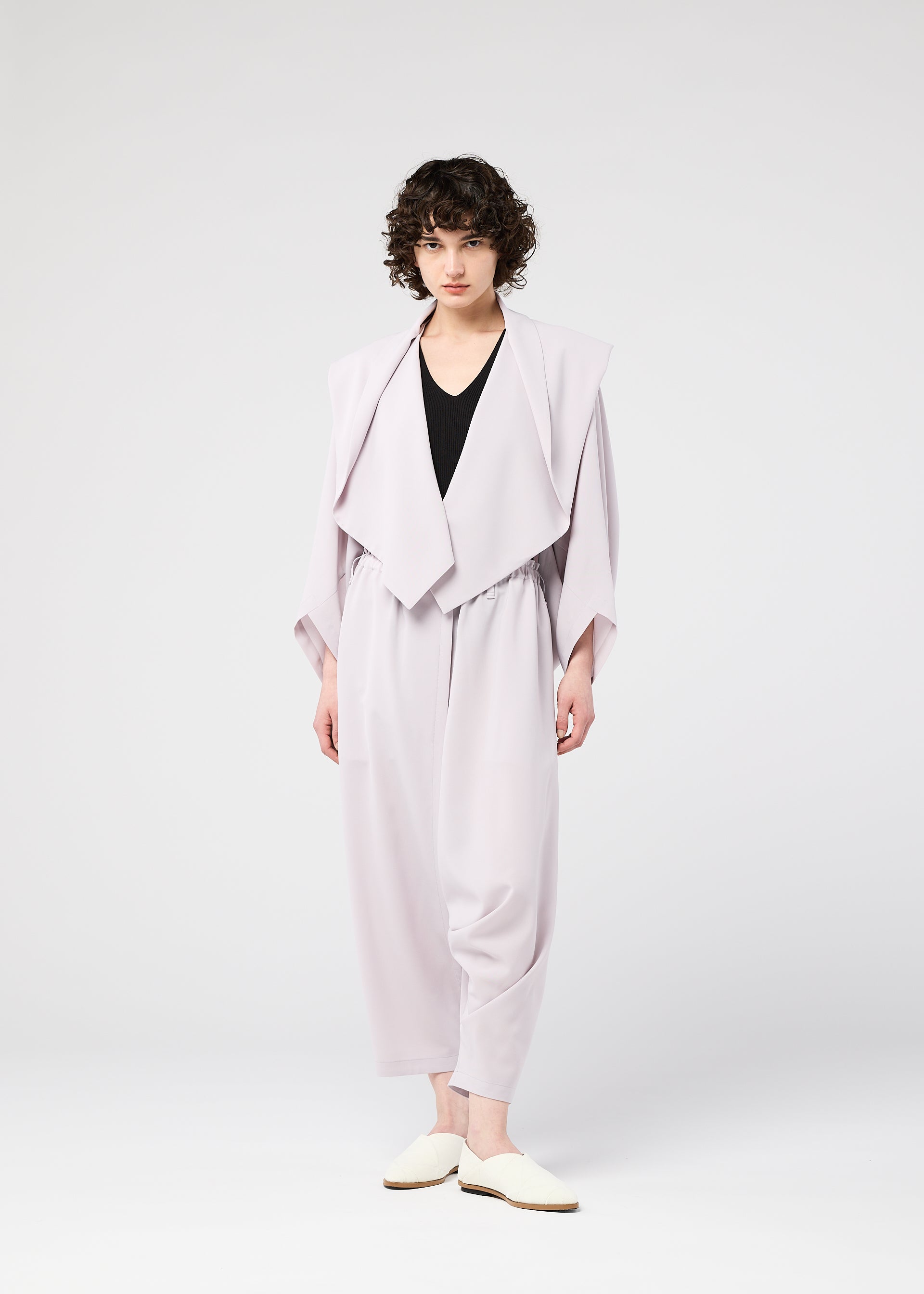 A model wears the 132 5. ISSEY MIYAKE SEAMLESS cardigan.
