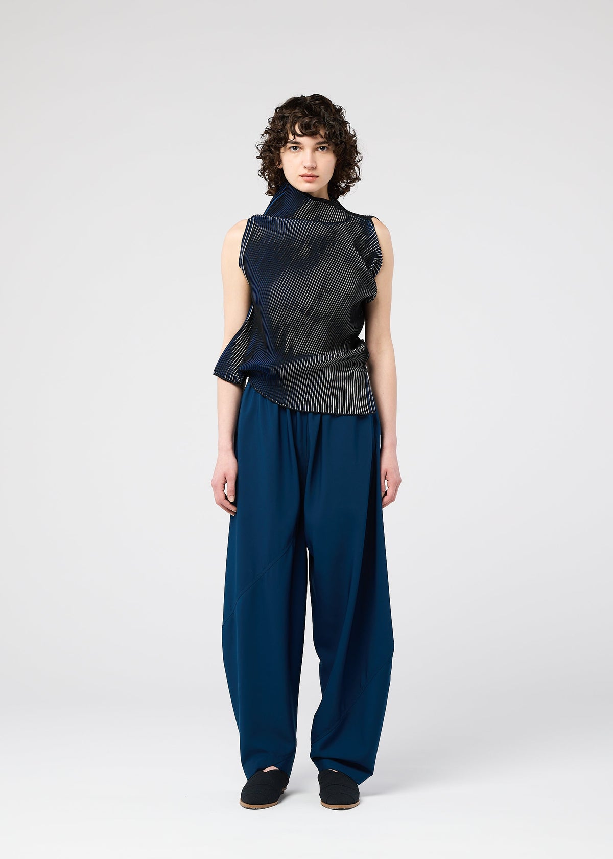 A model wears the 132 5. ISSEY MIYAKE FACET KNIT top.