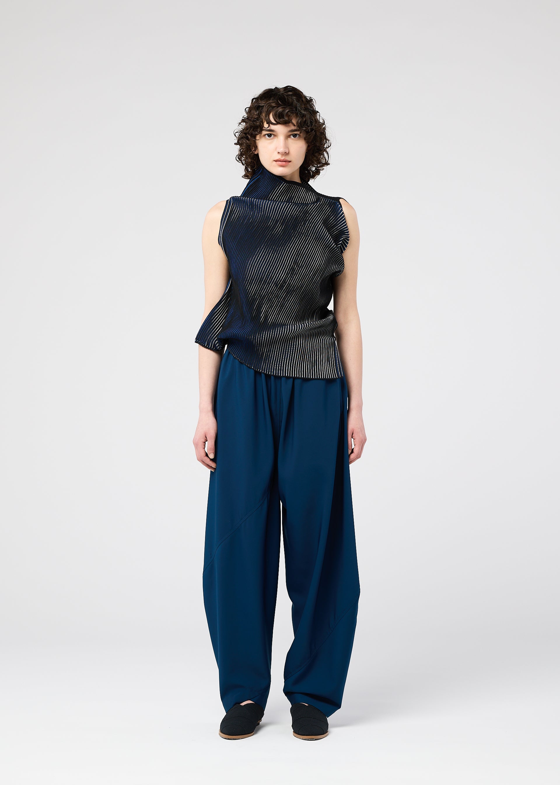 A model wears the 132 5. ISSEY MIYAKE FACET KNIT top.