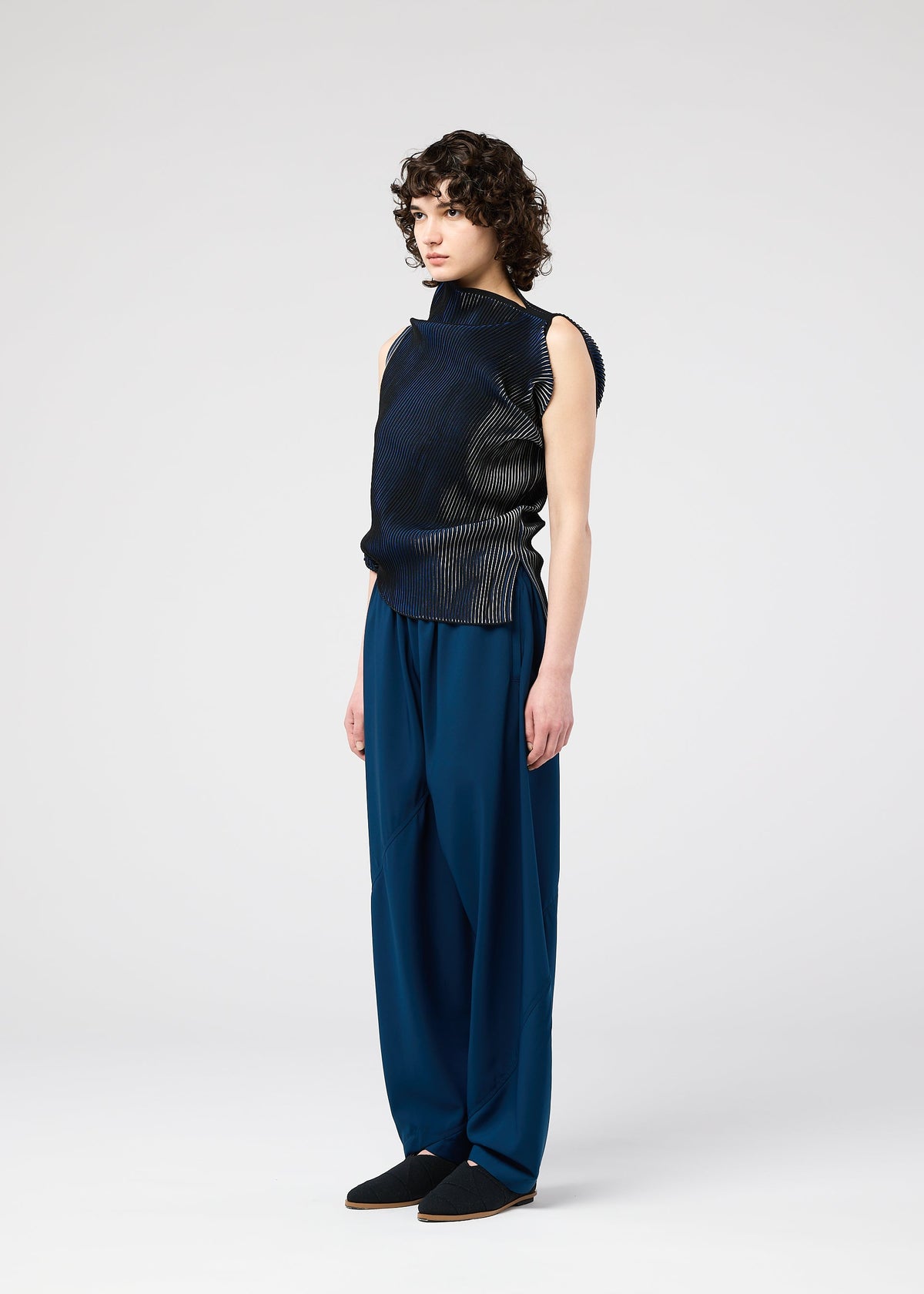 A model wears the 132 5. ISSEY MIYAKE FACET KNIT top.