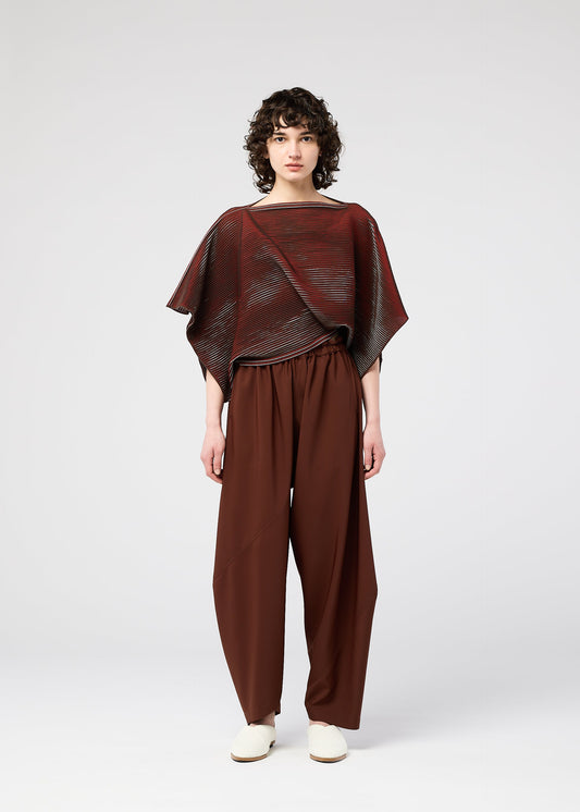 A model wears the 132 5. ISSEY MIYAKE FACET KNIT top.