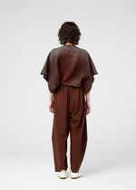 A model wears the 132 5. ISSEY MIYAKE FACET KNIT top.