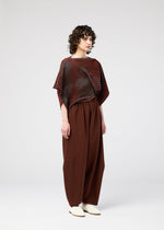 A model wears the 132 5. ISSEY MIYAKE FACET KNIT top.