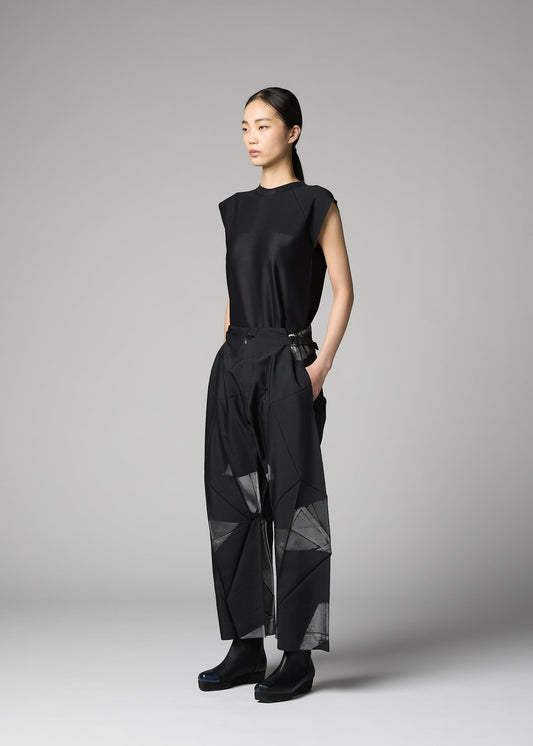 A model wears the 132 5. ISSEY MIYAKE F-BT f-bt-trousers-black-x-silver.