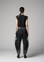 A model wears the 132 5. ISSEY MIYAKE F-BT f-bt-trousers-black-x-silver.