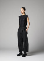 A model wears the 132 5. ISSEY MIYAKE F-BT f-bt-trousers-black.